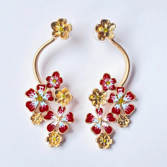 Floral earrings with gold accents on a white background