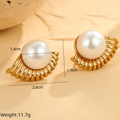 Gold-framed pearl earrings with measurements on a beige background
