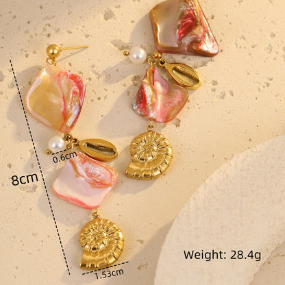 Pair of earrings with pink and gold elements on a beige background, showing measurements and weight.
