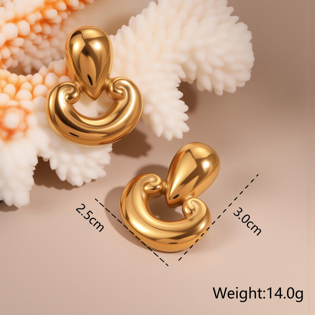 Gold earrings with measurements and weight details on a beige background