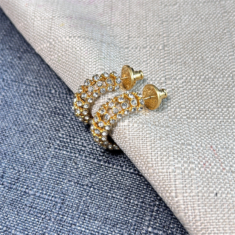 Gold hoop earrings with clear stones