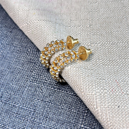 Gold hoop earrings with clear stones